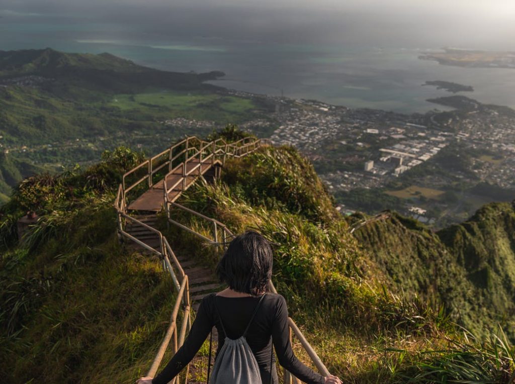 person walking on metal stairs